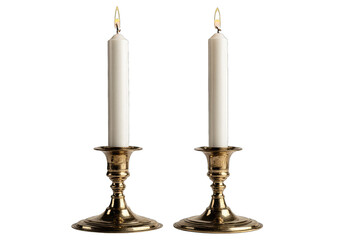 Two brass candle holders with white pillar candles