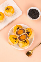 Golden Egg Custard Pastries with Black Sesame Seeds - Traditional Asian Handmade Dessert Cakes