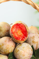 Fresh Longan Fruits from Gutian China - Tropical Asian Fruit with Red Flesh in Wicker Basket