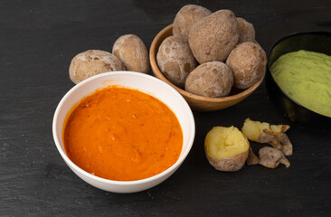 Red mojo rojo and green mojo verde sauces, traditional Tenerife dips, mojo picon dressing