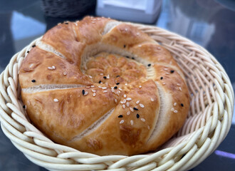 Uzbek round bread. Traditional breakfast tandir bakery, Kazakh tandoor lavash