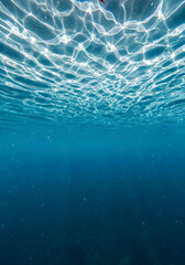Fototapeta premium Underwater Ocean Sunlight Reflections Blue Water Surface Ripples, Sunlight Patterns, Abstract Textured Background.