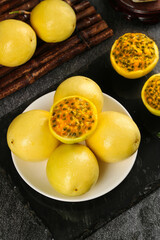 Fresh Golden Passion Fruit from Hainan China Cut Half Showing Seeds Pulp Honey Sweet Tropical Exotic Fruit