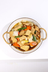 Handmade Northeast Asian Stewed Tofu and Vegetable Dish in Traditional Ceramic Bowl