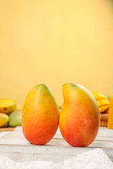 Fresh Ripe Mango Halves on Wooden Surface - Tropical Fruit Photography