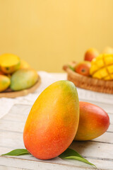 Fresh Ripe Hainan Mangoes on Wooden Table - Tropical Fruit Food Photography