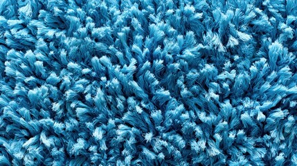 Textured blue fabric with vibrant plush fibers showcased in close-up view highlighting color and detail