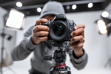 Photographer setting up camera to shoot product for advertisement, 