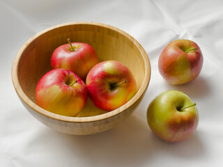 Autumn apples in a wooden bowl