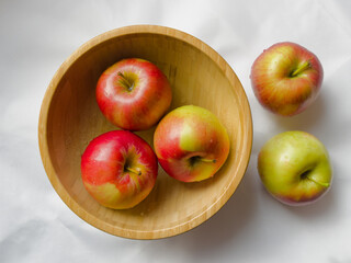 Autumn apples in a wooden bowl