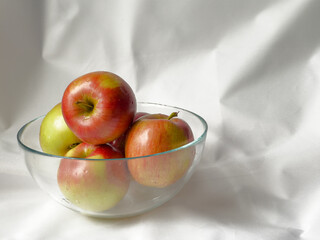 Apples in a glass bowl