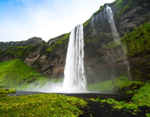 Majestic waterfall cascading down a dramatic cliff face