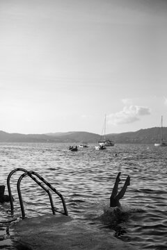 black and white photo of a girl in the water