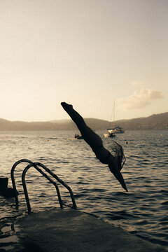 portrait of a woman jumping in to the water