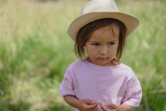Portrait. Two sisters have a picnic in the summer garden. Childhood