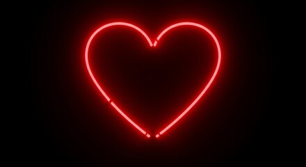 Glowing red neon heart on black background - symbol of love and romance