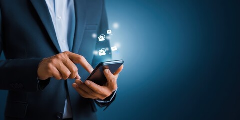 The smartphone in a businessman's hands with glowing app icons and notifications