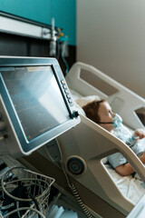 Child Patient Lying in Hospital Therapy Room