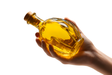 Hand holding a glass bottle filled with golden cooking oil isolated on transparent background
