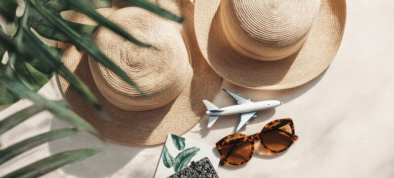 The Straw Hat and Sunglasses with Model Airplane for Tropical Vacation Planning - Powered by Adobe