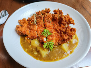 Crispy golden katsu meets rich Japanese curry—comfort food perfection on one plate. Irresistible crunch, savory flavor, and heartwarming taste in every bite