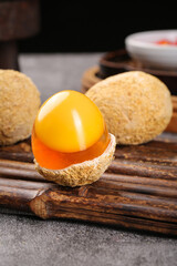 Fresh Raw Egg Yolk in Shell on Wooden Cutting Board - Natural Cooking Ingredient
