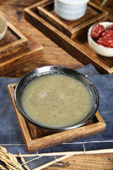 Traditional Rice Porridge in Stone Bowl - Healthy Asian Breakfast with Grains and Cereals