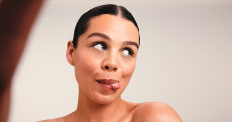 Skincare, selfie and woman with tongue out, studio or profile picture on social media and...