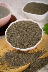 Organic Millet Grains and Flour in Bowls - Healthy Superfood Ingredients