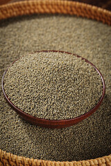 Organic Highland Millet Grains in Wooden Bowl - Healthy Superfood for Porridge and Cooking Preparation