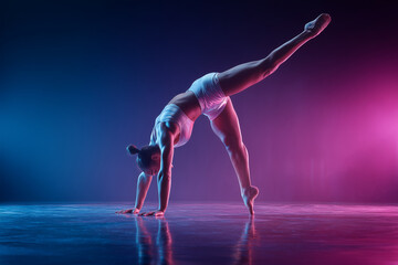 Graceful contemporary dancer performing a one-handed handstand split in dramatic blue and pink stage lighting, showcasing strength and flexibility