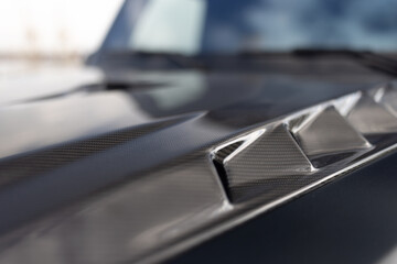 Air intake in the carbon hood of powered suv car