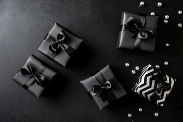 Elegant and sophisticated composition: Three gift boxes with black ribbons, bow