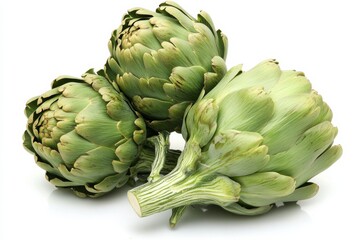 Obraz premium Fresh green artichokes arranged in a pyramid formation on white raw artichoke isolated