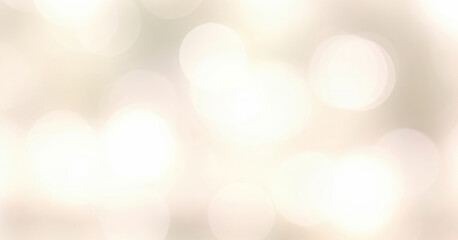 Obraz premium Abstract bokeh background with soft white and beige tones creating a blurred effect, glowing gently to produce a dreamy luminous ambience filled with serenity.