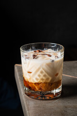 A creamy cocktail with vibrant layers of caramel and cream invites indulgence