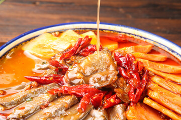 Spicy Chongqing Hot Pot with Blood Sausage and Wonton Dumplings - Traditional Chinese Cuisine
