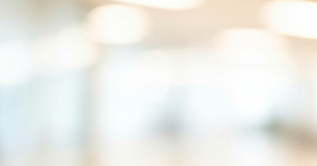 Abstract blurred background with soft light and bokeh effect in neutral tones, creating a dreamy serene ambience with smooth airy gradients and subtle glow.