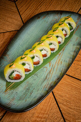 Fresh sushi rolls artfully arranged on a unique plate showcase culinary creativity