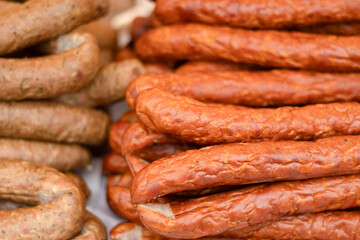 Selection of various sausages displayed at a market fair