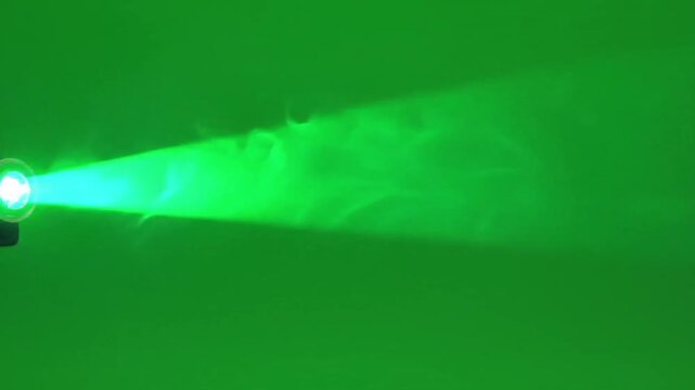 Green Beam of Light: A vivid beam of green light, emanating from a source, cuts through a vibrant atmosphere, showcasing energy and illumination in an eye-catching display.