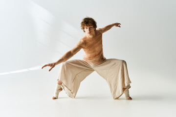Obraz premium Expressive movements of a young dancer in a contemporary studio setting