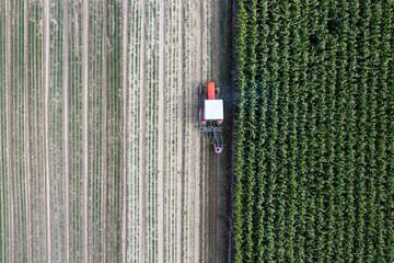Aerial View of Tractor Working on Farmland, Poland