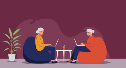 Two senior women actively engage with laptops on beanbag chairs, showcasing digital literacy and modern lifestyle for older adults. Ideal for technology, education, or elderly care concepts.