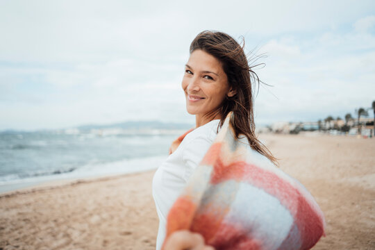 Carefree woman spending leisure time at beach