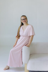 Happy woman smilling at home. Cozy natural portrait of caucasian blondie woman in eye glasses