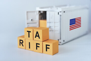Carton printed word "Tariff"  unload from container. US new import taxes announced by Donal Trump. Affected to baseline tariff, reciprocal tariffs,consumers,global economy
