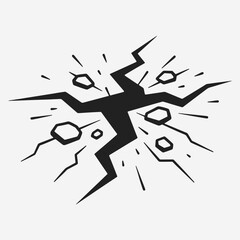 A black and white image of a crack in the ground with rocks and debris.