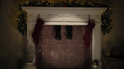4K: Father Christmas stuck in the chimney on Christmas Eve. Santa Claus legs are dangling. Stock Video Clip Footage - Powered by Adobe