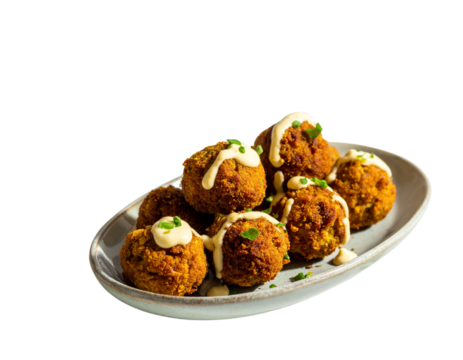 Vegan falafel balls with garlic aioli and festive table setting isolated on transparent background PNG